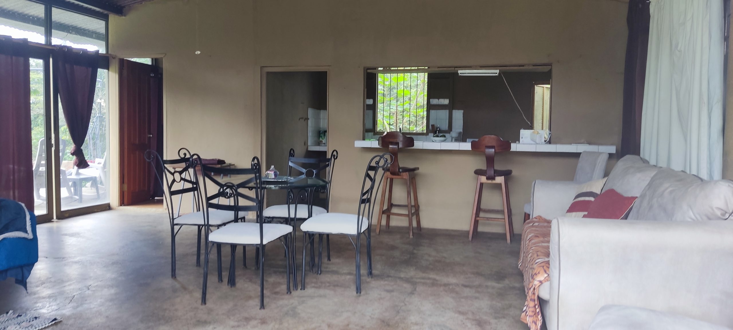 Living and kitchen area inside lodging at Jungla de Panama
