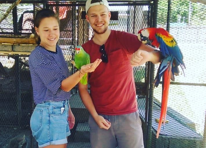 Visitors interacting with rescued wildlife at Jungla de Panama